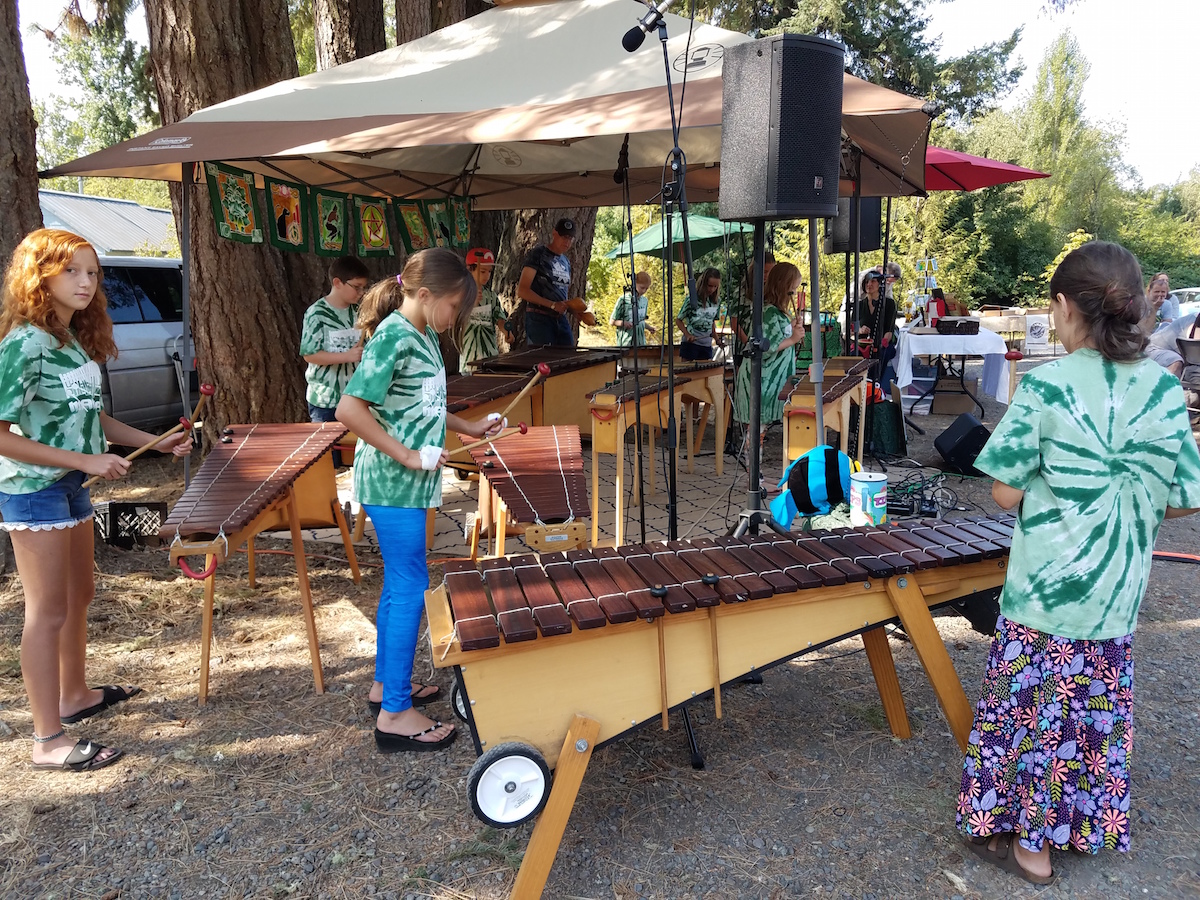 Adams Elementary School Marimba Band performing at the Spencer Creek Market