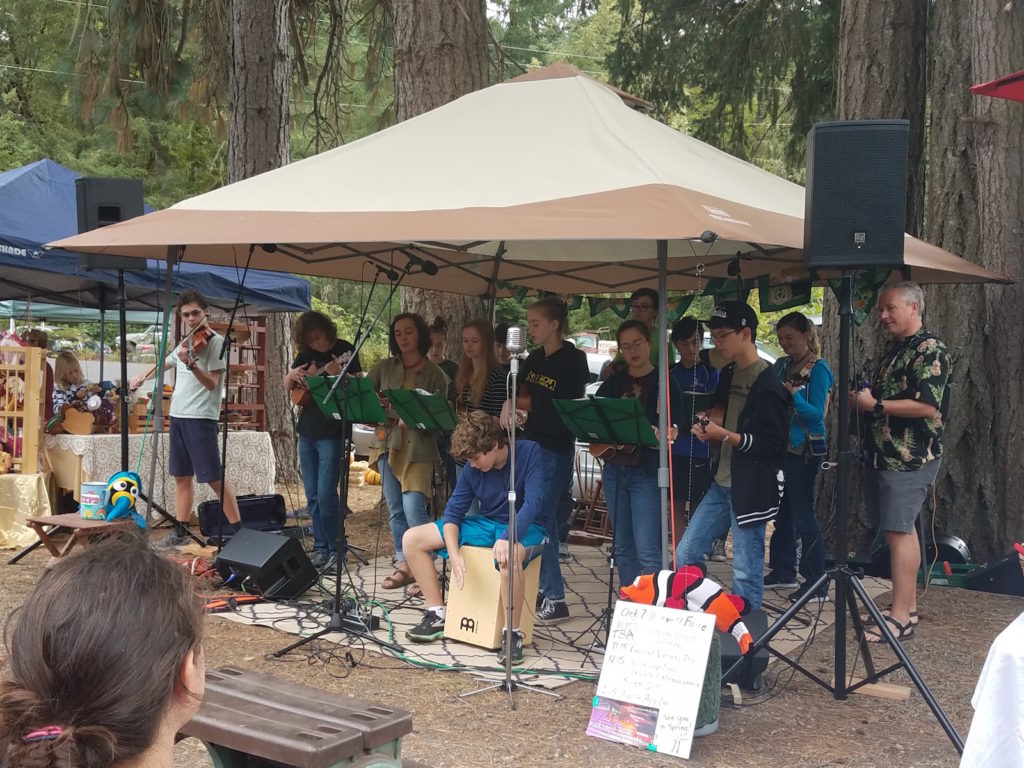 TRUE perform during the 2017 Harvest Fair at the Spencer Creek Growers Market